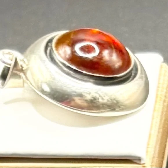 A Sterling Silver Round Pendent with a Lg Amber stone